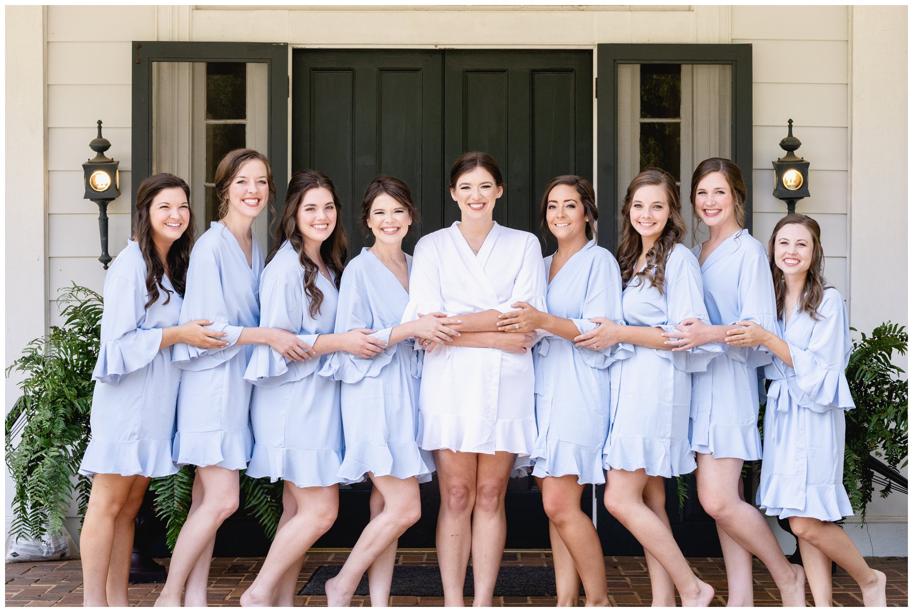 bride and bridesmaids in getting ready clothes,