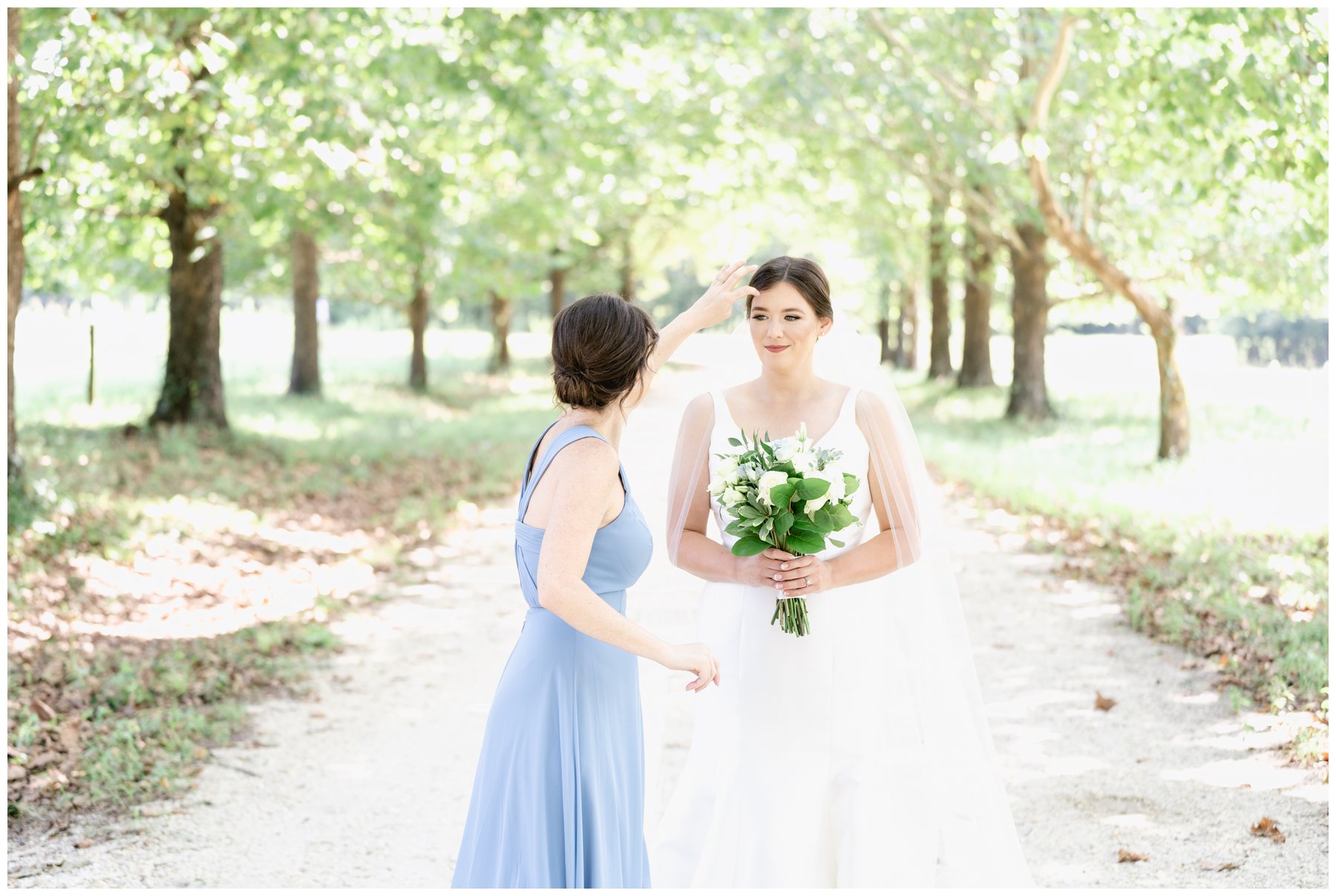 matron of honor helping bride,