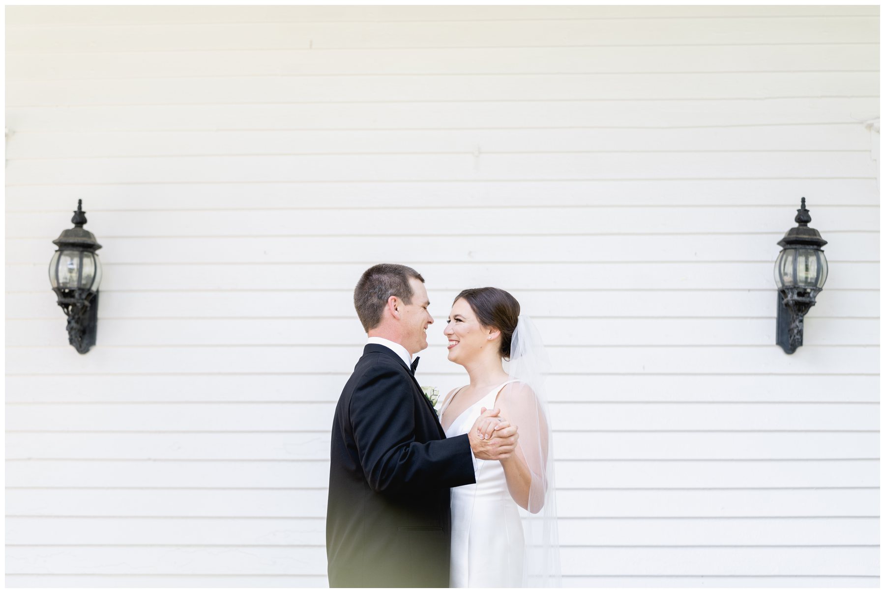 bride and groom dancing on church porch,