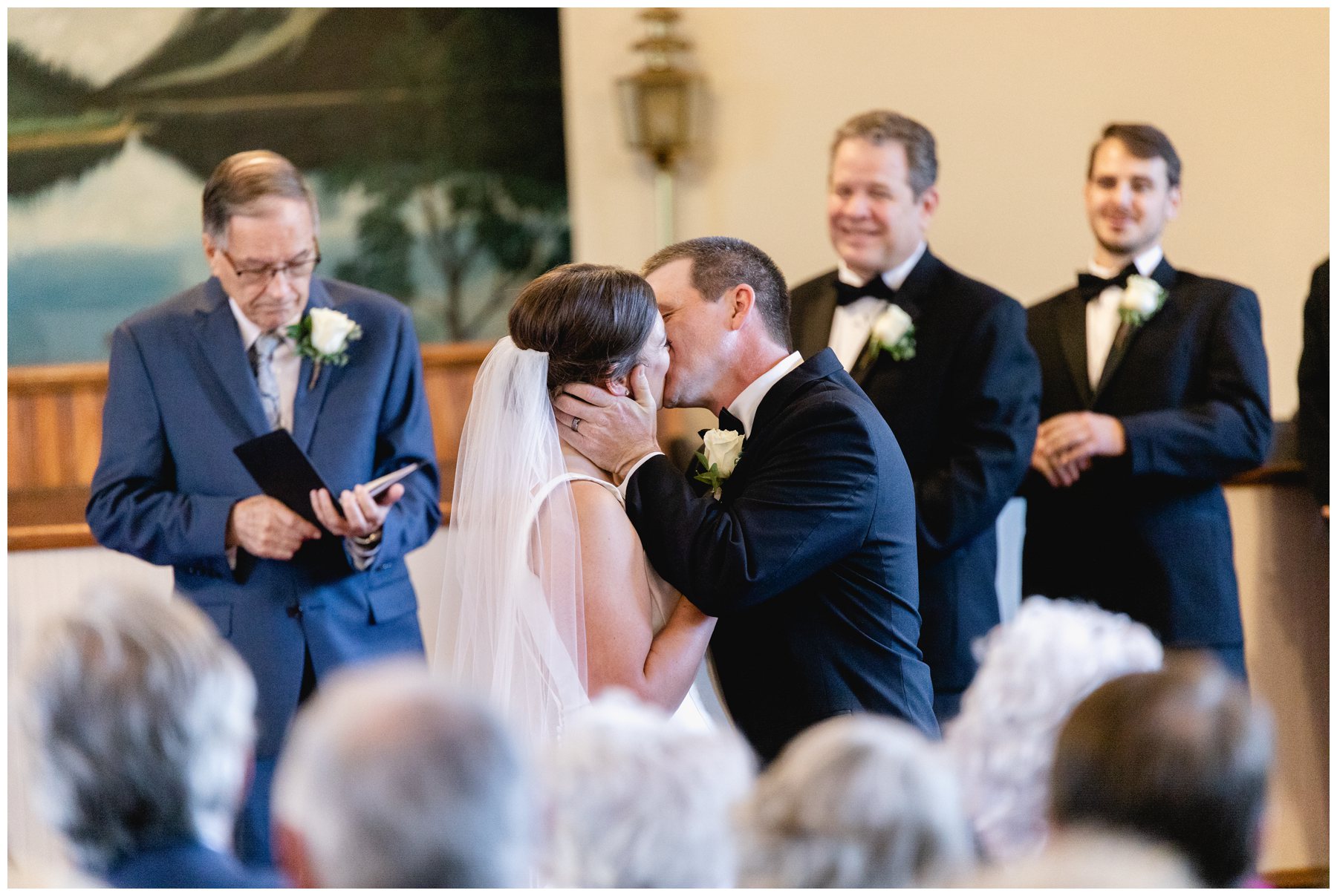 bride and groom kiss at end of ceremony,