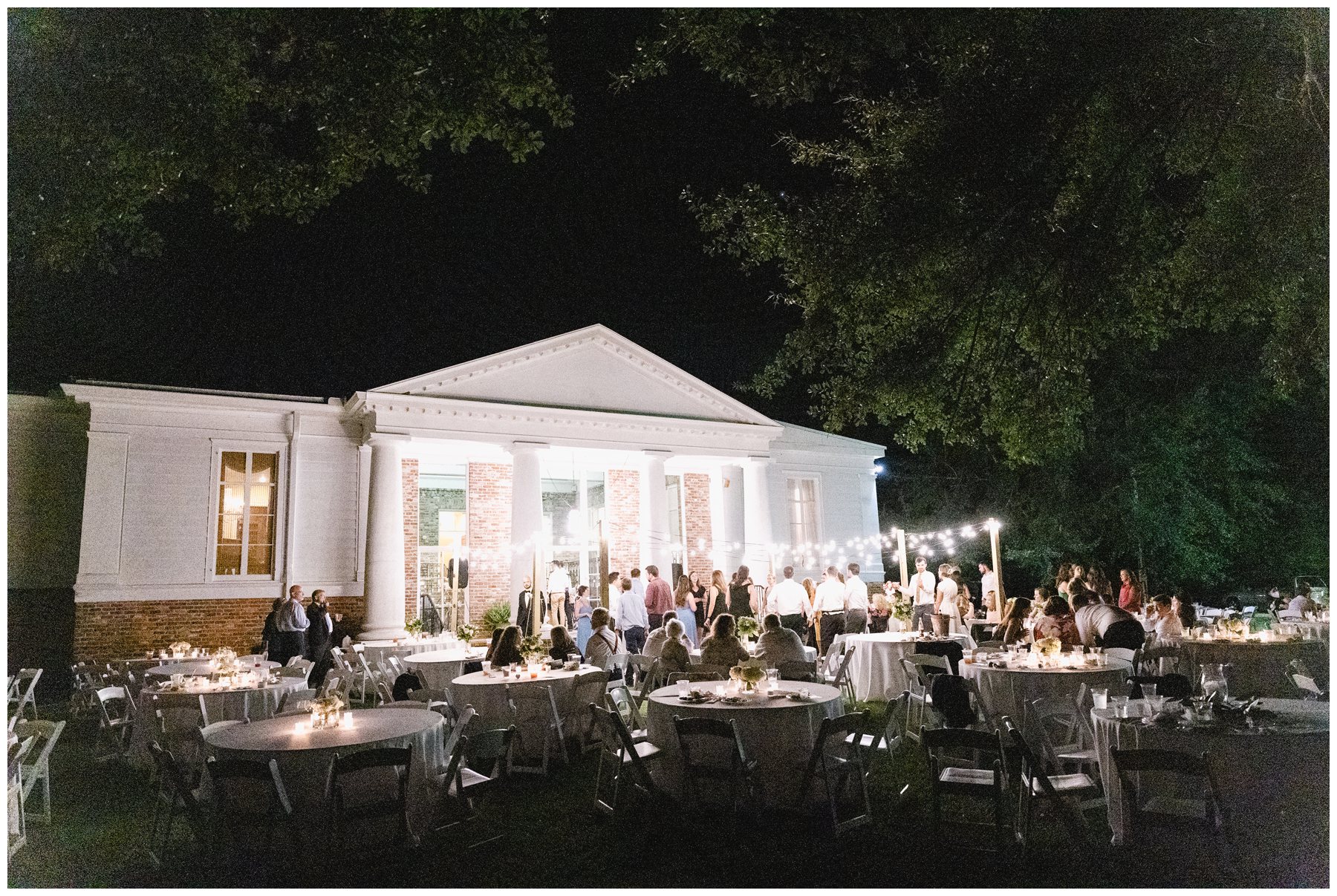 back of Merango House at night set up for wedding. reception,